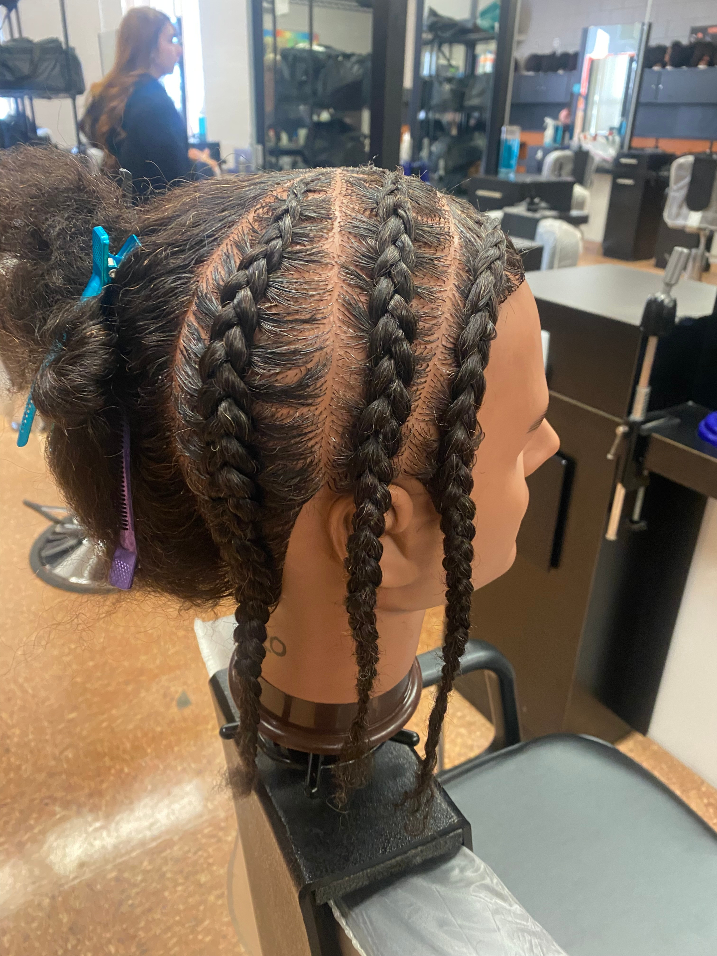 Precision stitch cornrows in progress