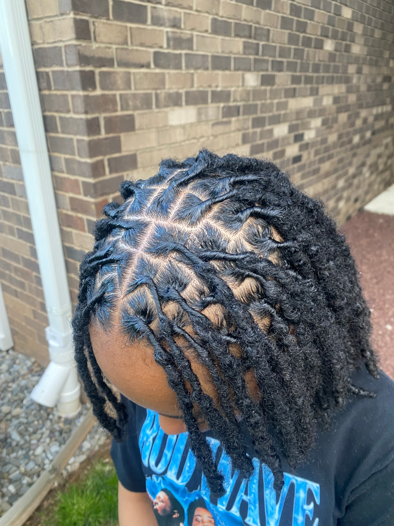 Sharp two-strand twists, outdoor portrait
